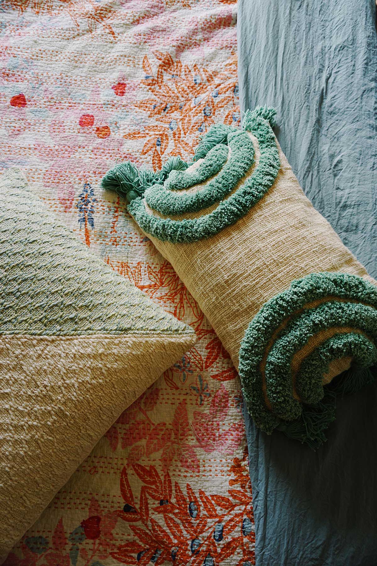 hand tufted throw pillow in rainbow aqua