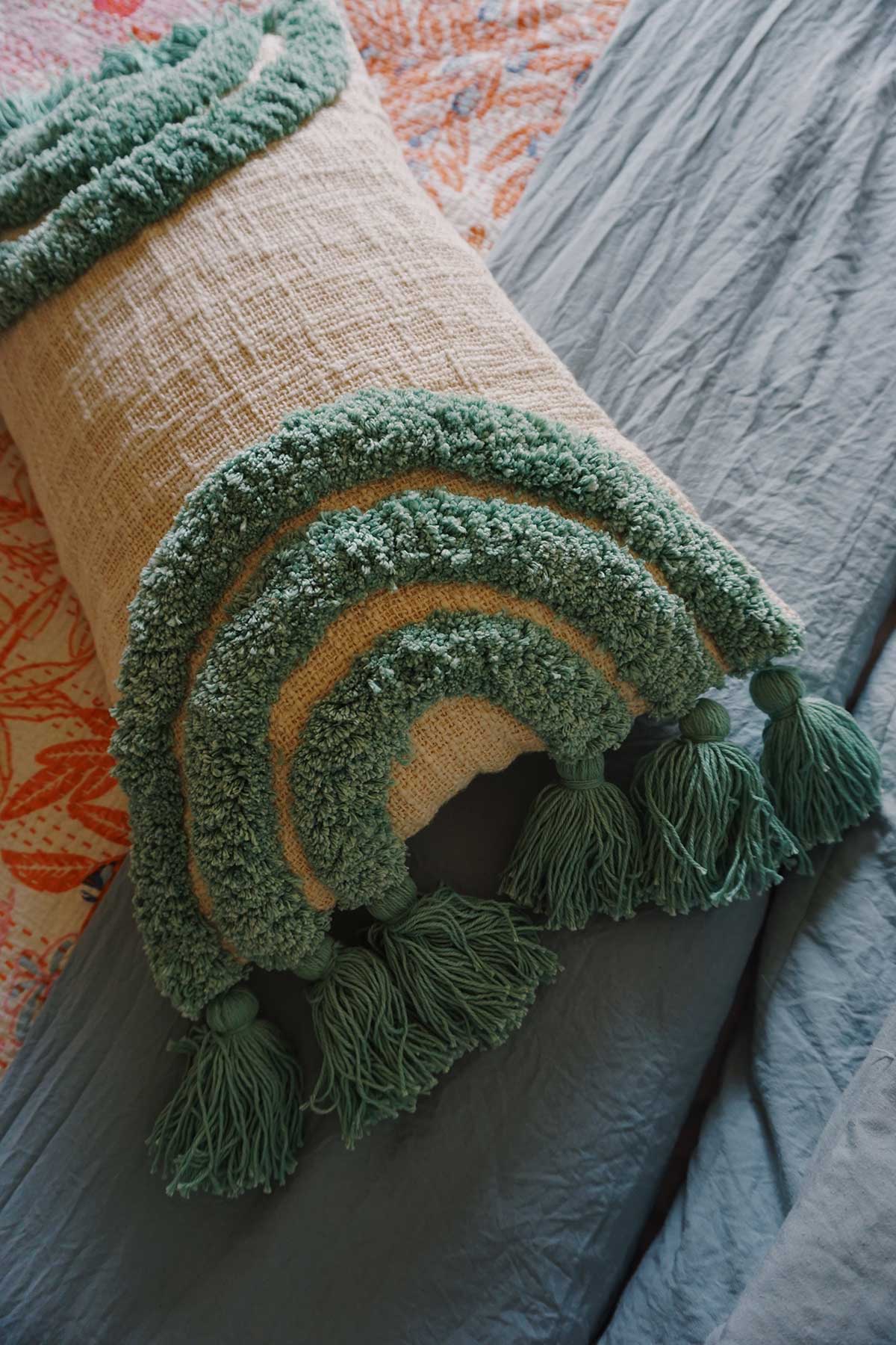 hand tufted throw pillow in rainbow aqua