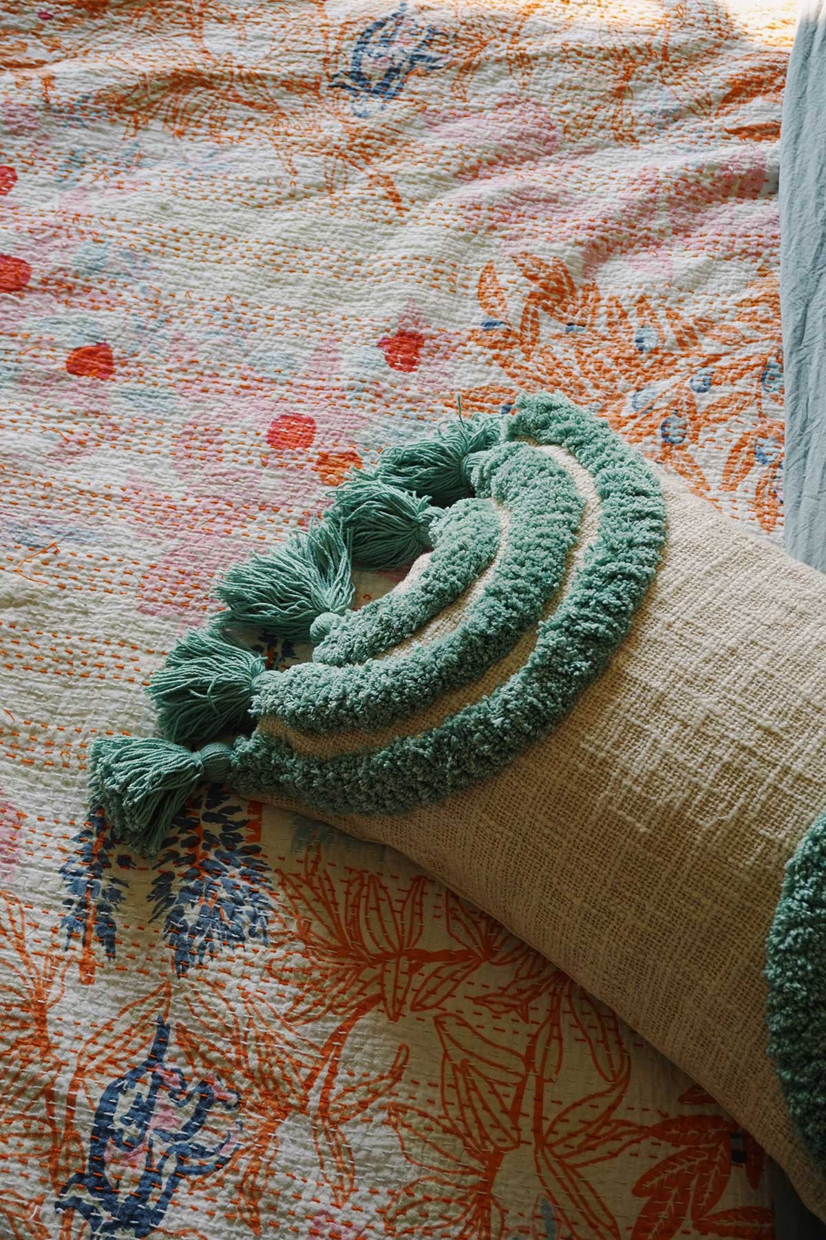 hand tufted throw pillow in rainbow aqua