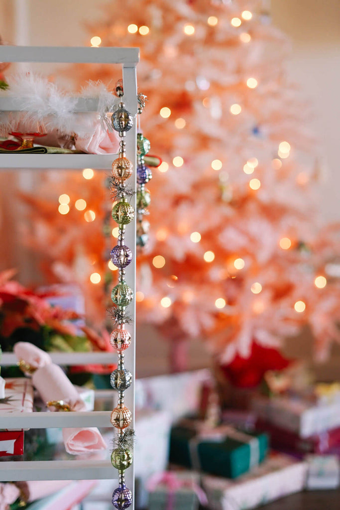 garland on holiday bar cart with pink christmas tree