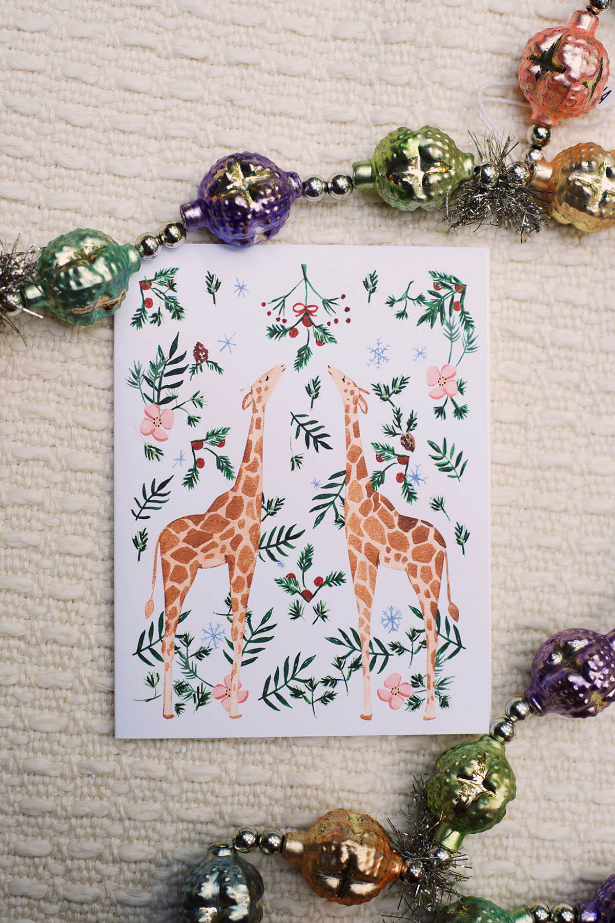 festive giraffes holiday card by sabina fenn