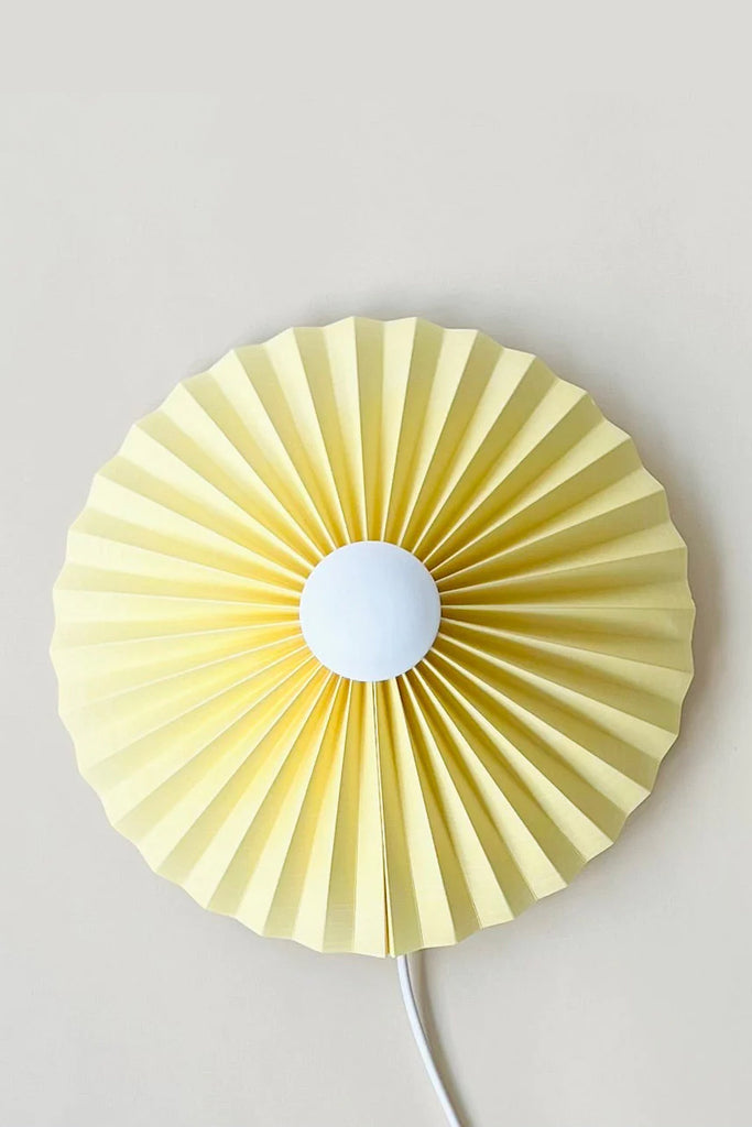 pastel yellow pleated wall lamp by shady business