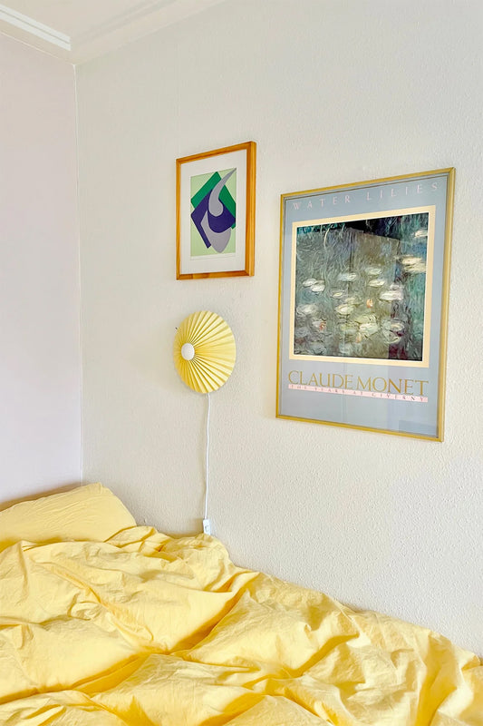 pastel yellow pleated wall lamp by shady business