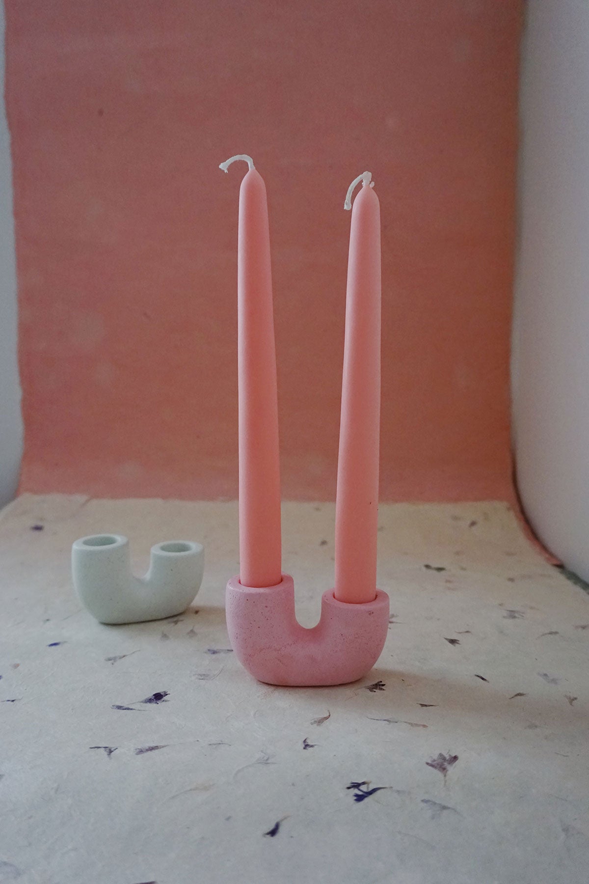 pink taper candle holder via wallflower shop